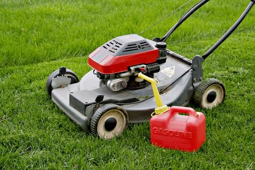 Lawn Mower and Gasoline Tank in the Field Lawn Mower and Gasoline Tank in the Field
